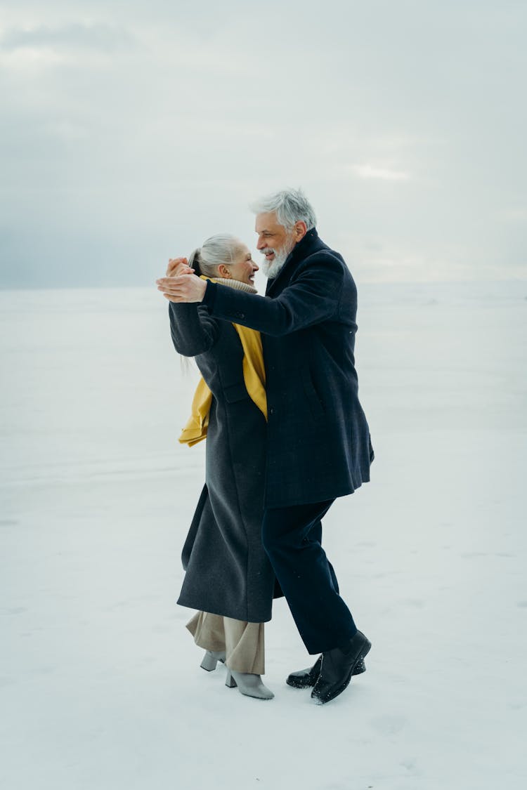 Beautiful Couple Dancing On Snow