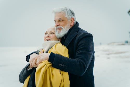 Elderly Man Hugging an Elderly Woman