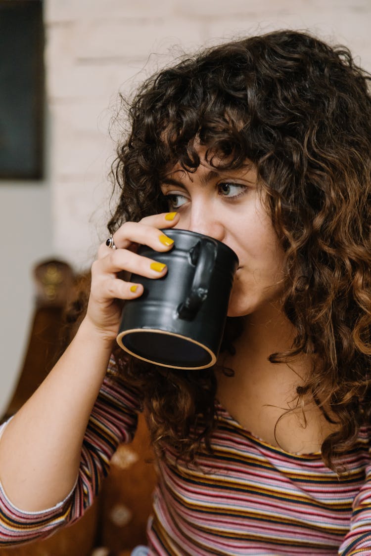 Selective Focus Photo Of A Girl Sipping Coffee