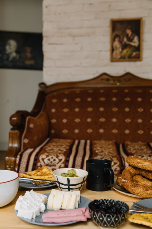Free A warm, inviting Turkish breakfast spread inside a charming Istanbul home, featuring simit, cheeses, and olives. Stock Photo