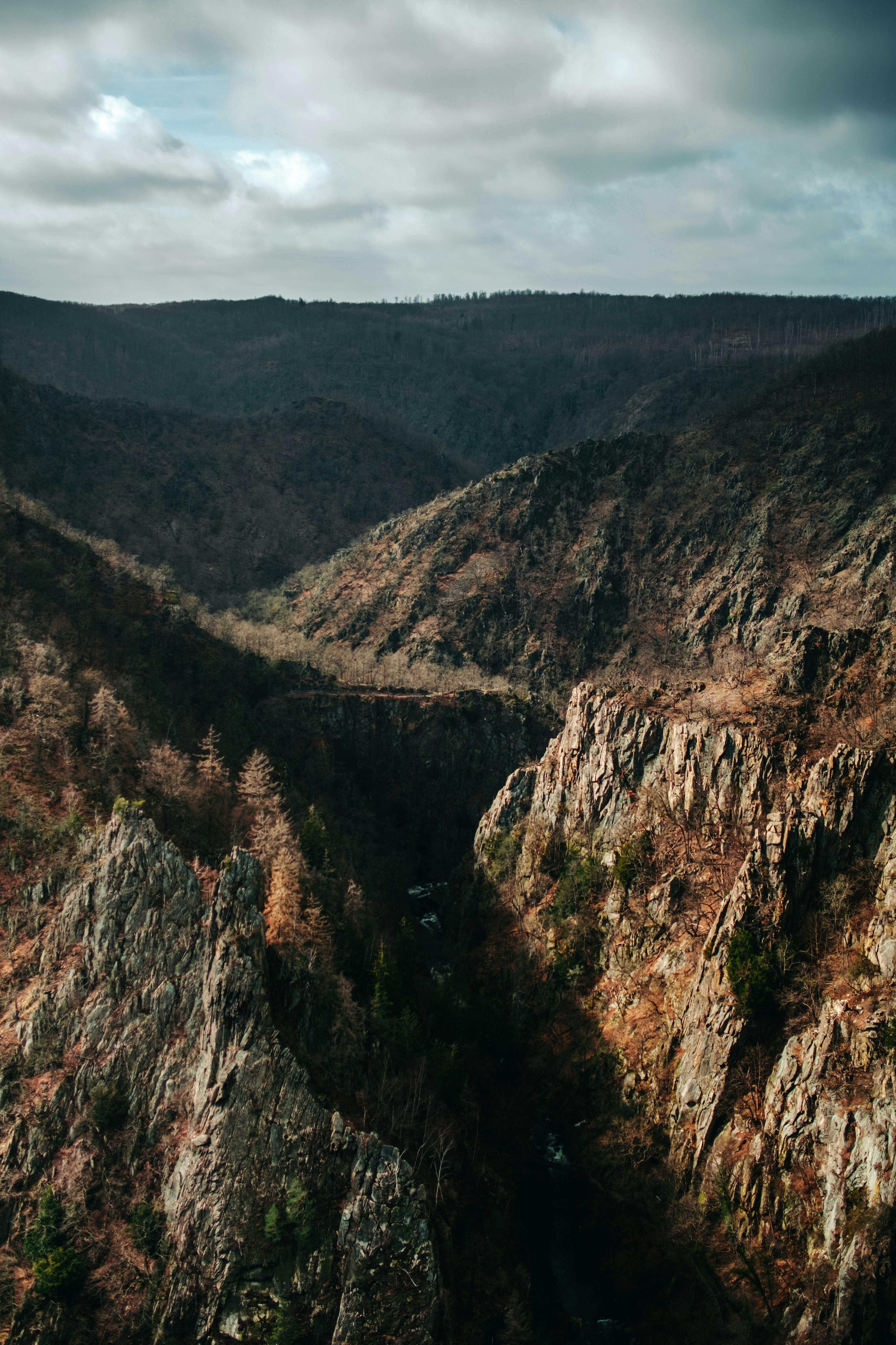 Breathtaking aerial view of Bode Gorge, showcasing fall colors and rugged landscape in Thale, Germany.