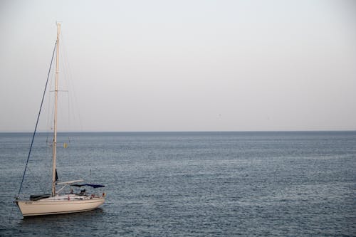 White Yacht on Ocean during Cloufy Day