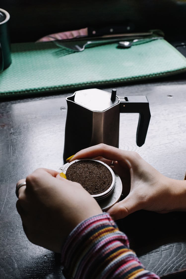 Person Making Coffee In Mocha