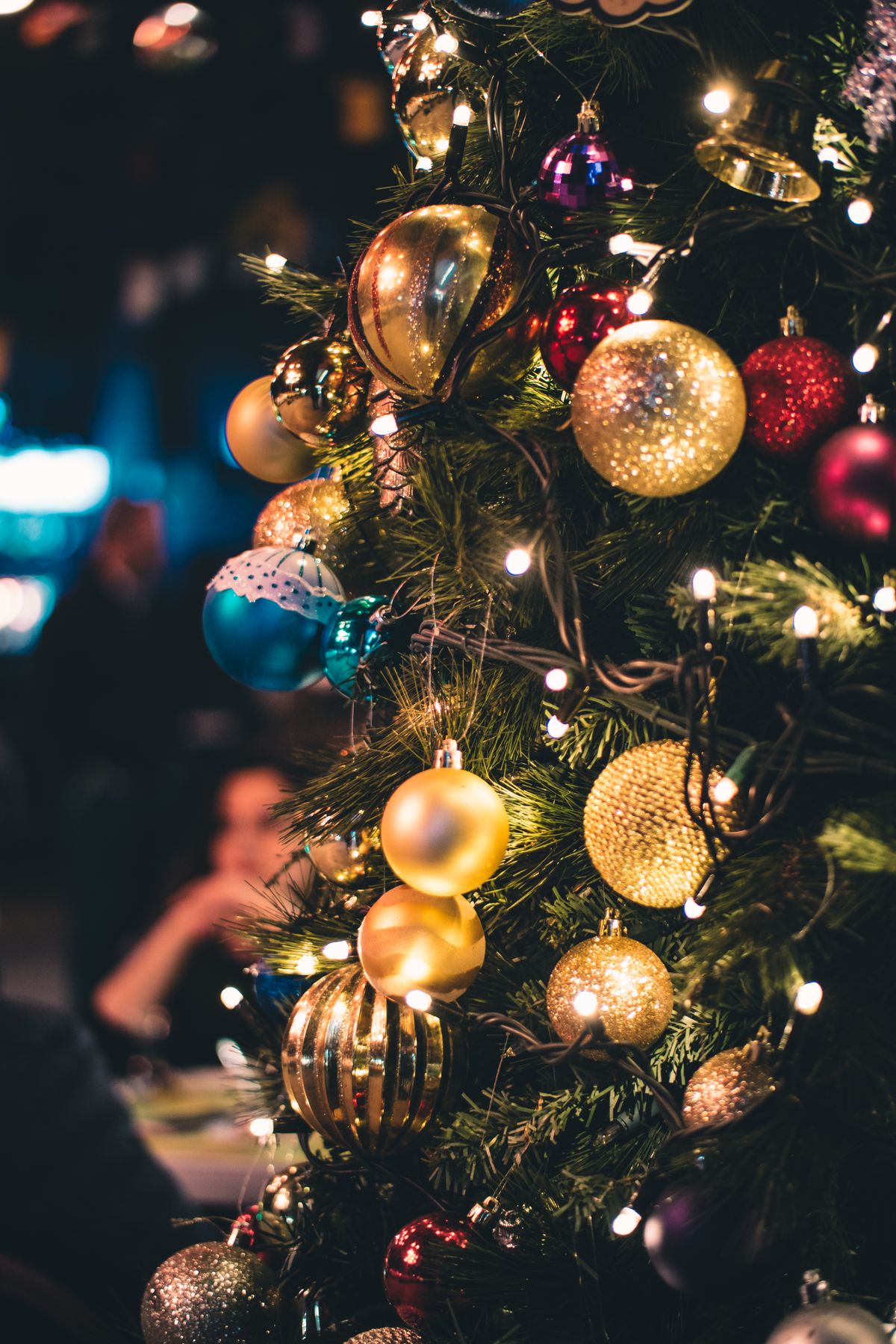 Close-up of a Christmas tree with clustered ornaments and lights
