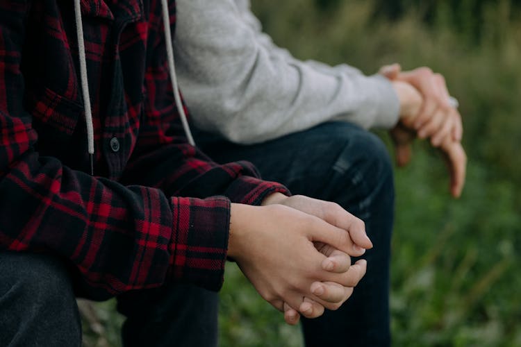 A Person Interlocking Fingers 