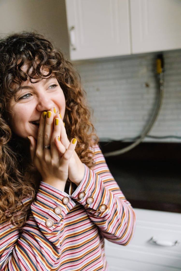 Woman In Striped Long Sleeves Laughing 