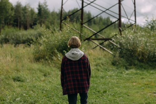 Back View of a Person Wearing a Plaid Jacket
