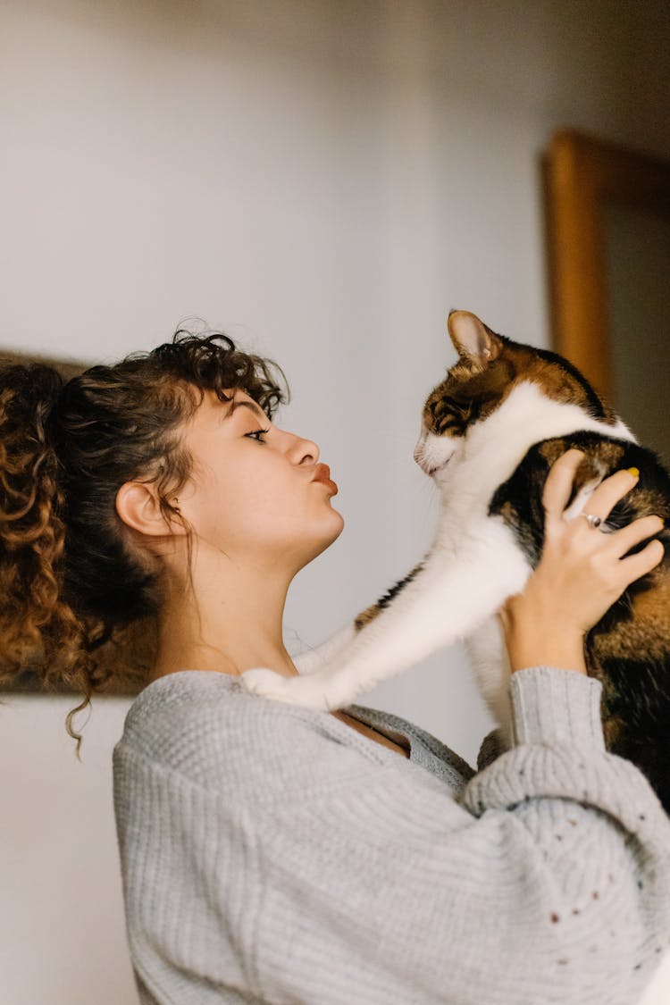 A Woman Kissing Her Cat