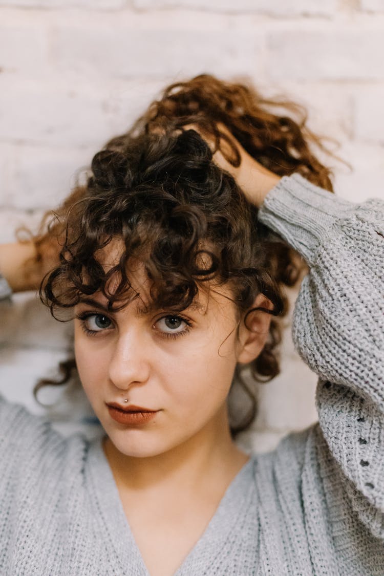 A Woman Tying Her Hair