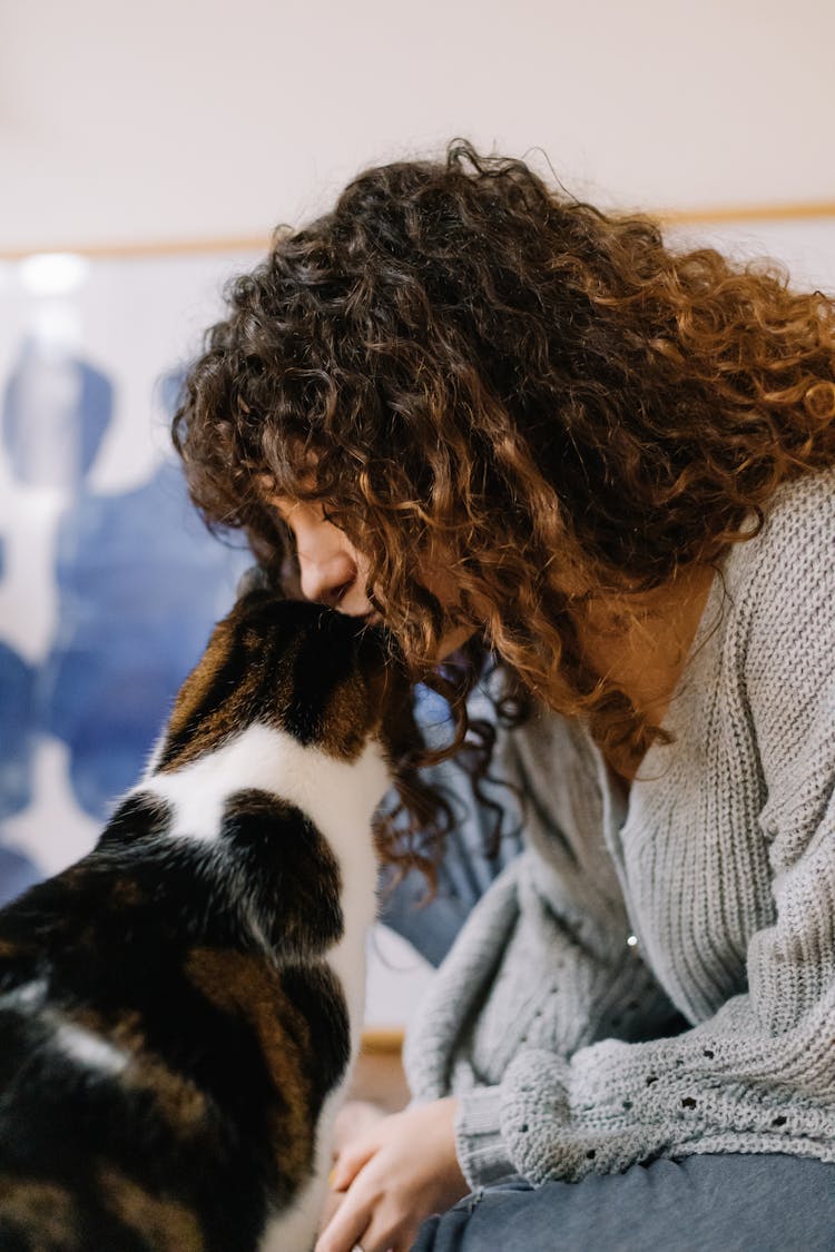 A Woman Kissing Her Cat