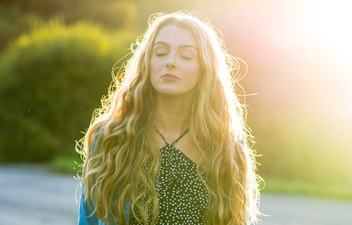 Backlit Portrait of Beautiful Young Woman 