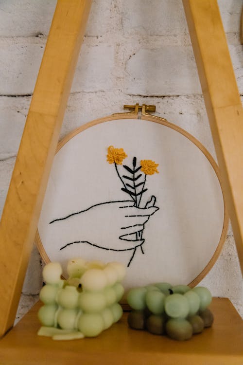 Hand and Flower Embroidered on White Cloth