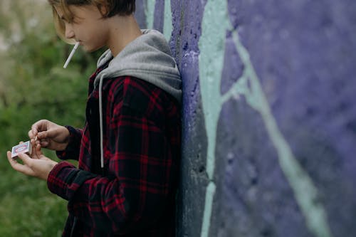 Teenage Boy Smoking Cigarette
