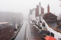 Water canal near aged houses