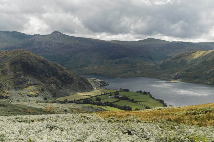 Mountains And Farm Fields Near River