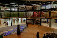 People in modern library with books