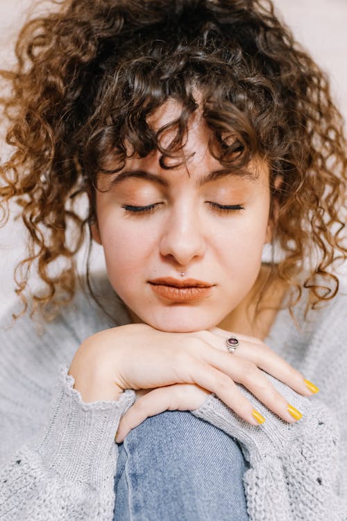 Close-Up Shot of a Curly-Haired Woman