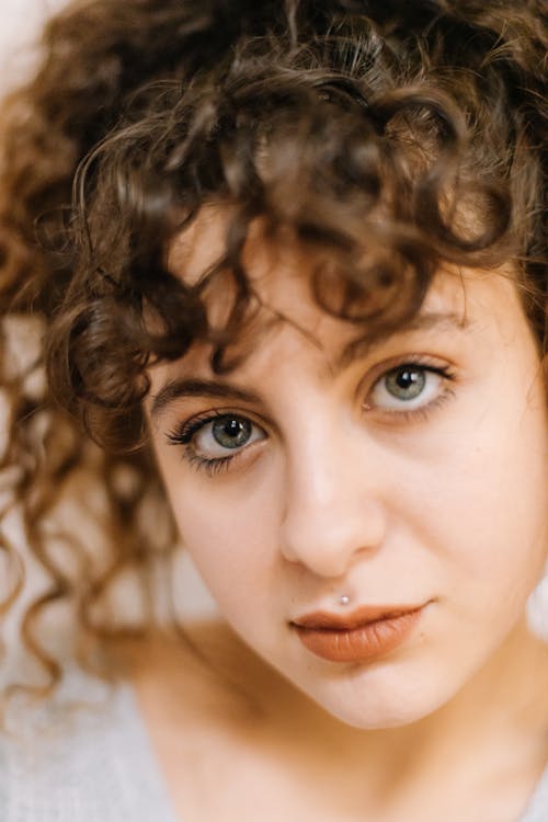 Close-Up Shot of a Curly-Haired Woman