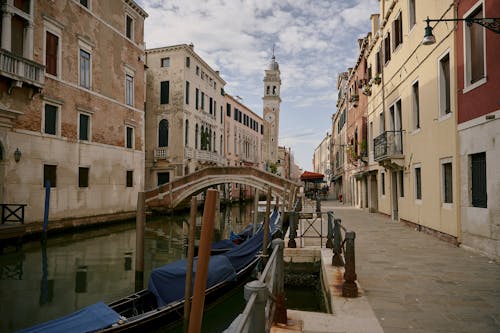 Gondolas in Canal in Street in Venice