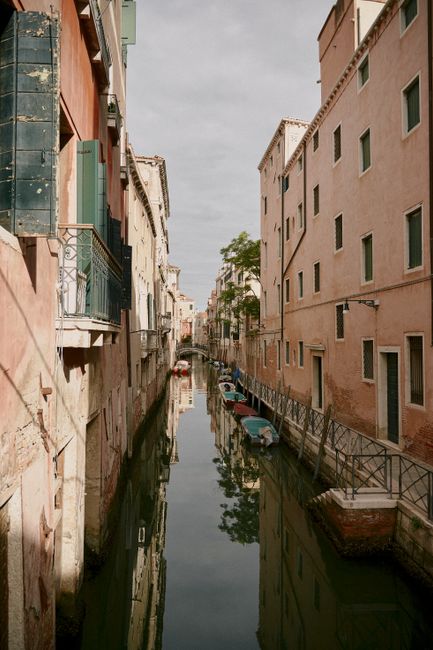 A peaceful canal view in Venice, Italy, showcasing traditional architecture.