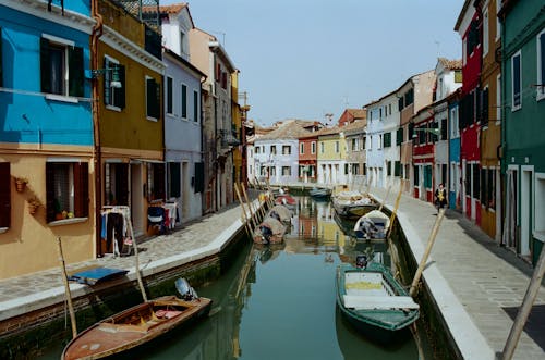 Free Colorful houses along narrow town canal Stock Photo
