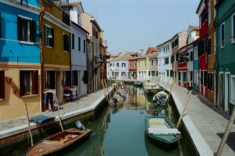 Colorful Houses Along Narrow Town Canal