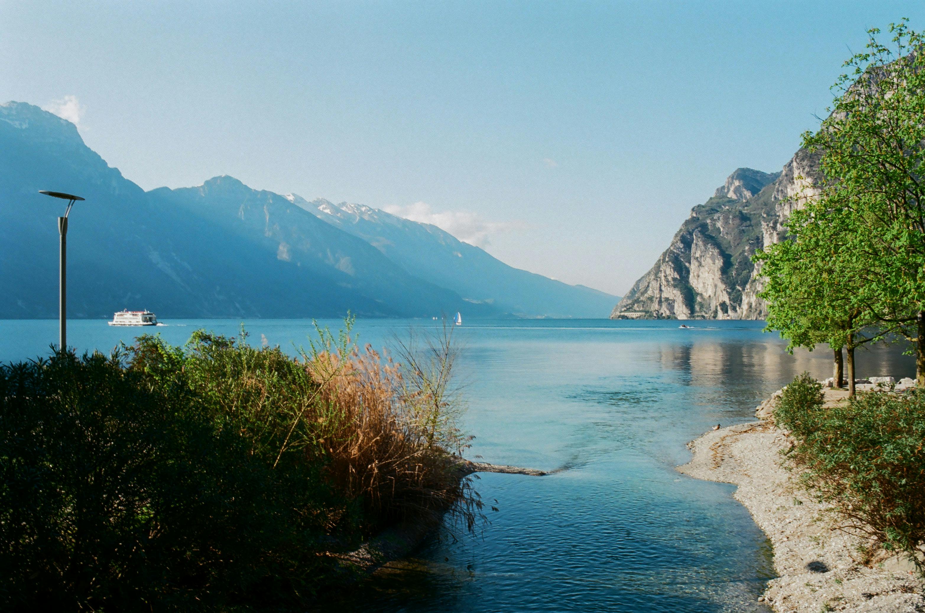 sea surrounded by mountain ridge