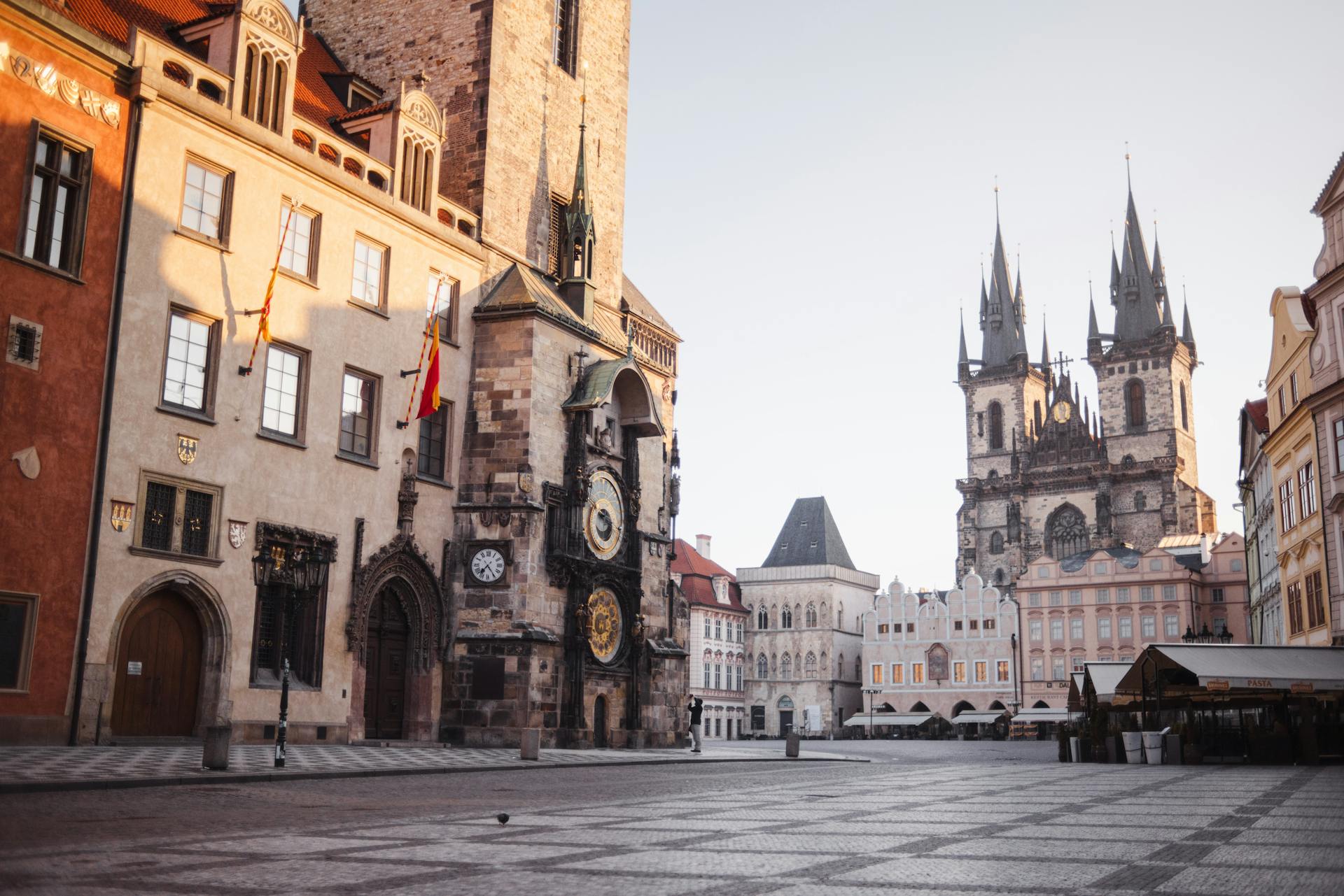 Church of Our Lady before Tyn and aged house exteriors against tiled pavement in Prague Czech Republic