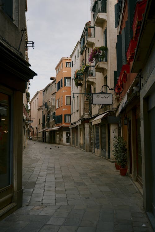 Narrow pedestrian street between old residential buildings