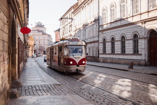 Tram riding on city street