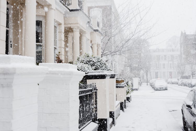 Snowy Street With Residential Buildings