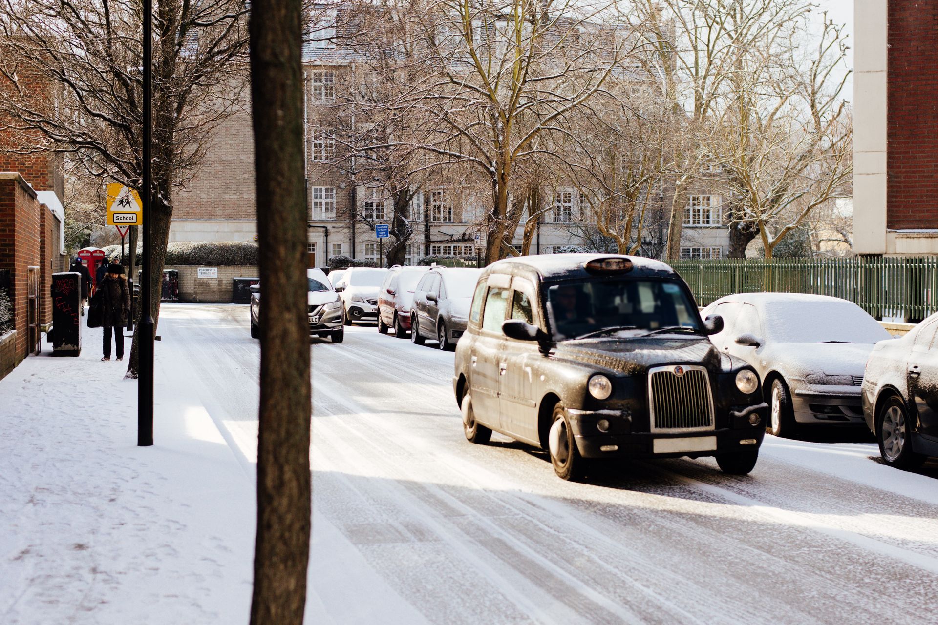 Retro car driving on snowy road