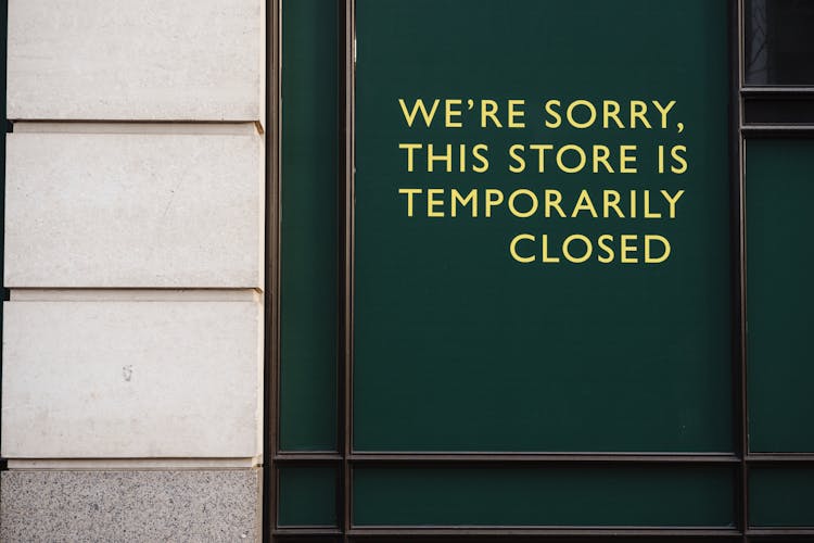 Closed Text Sign On A Building Facade