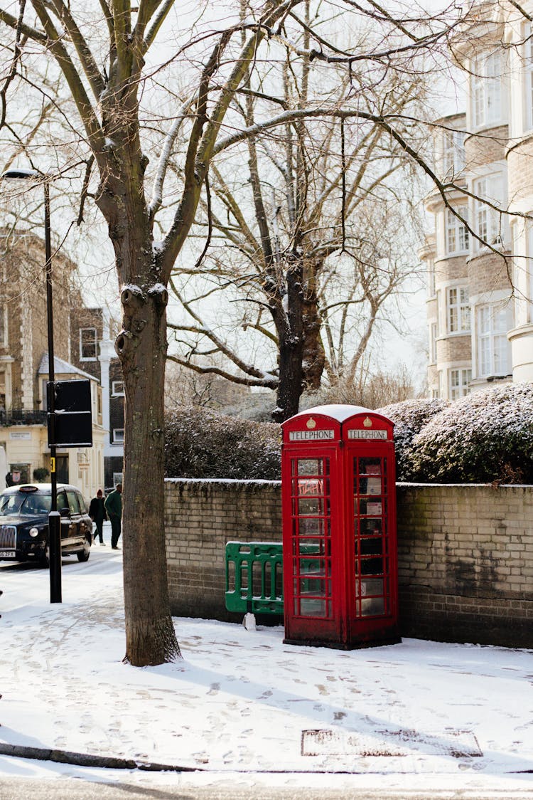 Telephone Booth On Snowy Street