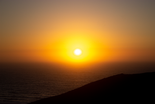 Captivating sunset view over the ocean in Odemira, Portugal, with vibrant colors and serene horizon.