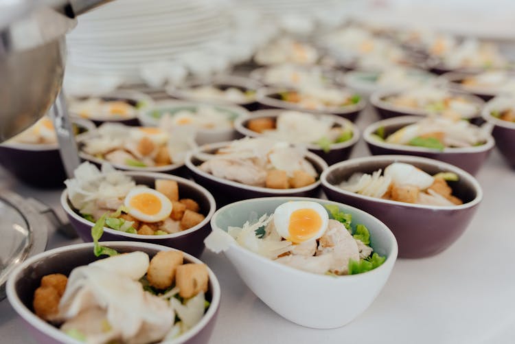 Bowls With Salad On Buffet Table