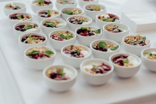 Bowls with granola on buffet table