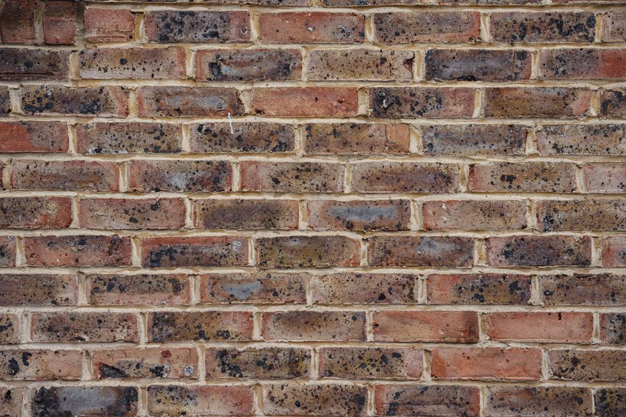 Stacked red bricks used in construction