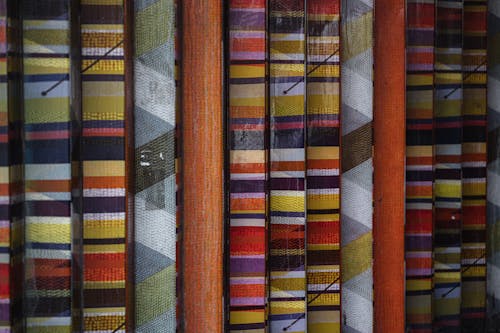 Many different bright textures of walls with colorful various stripes placed in rows