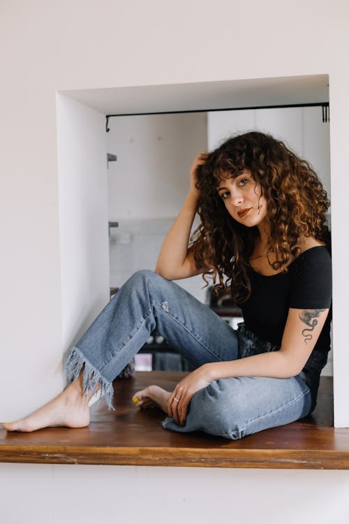 Woman Sitting on a Counter