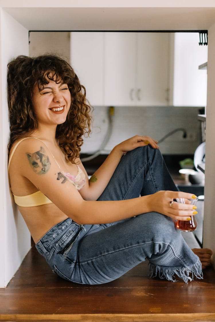 A Laughing Woman In A Bra