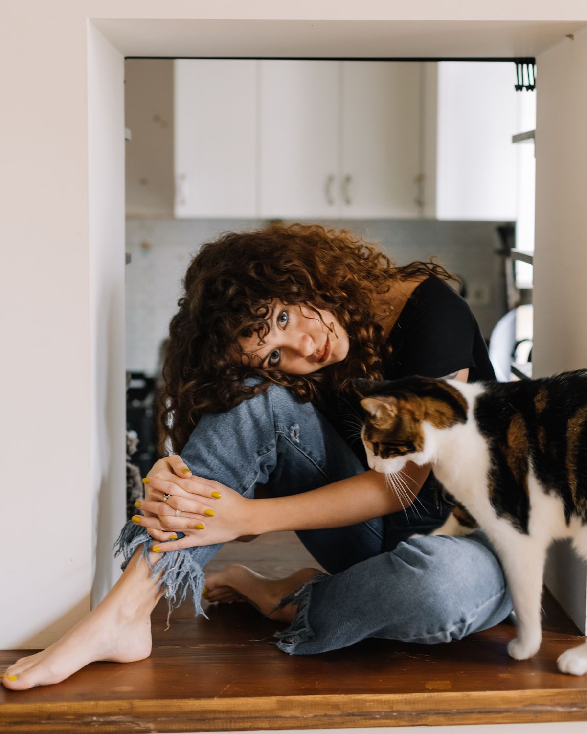 Pet parent spending a quiet moment at home with a cat