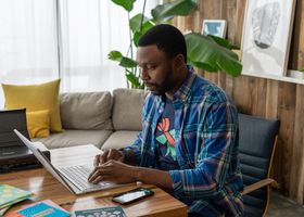African entrepreneur working on a laptop