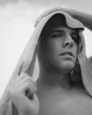 Grayscale Photo of Man Wearing White Knit Cap