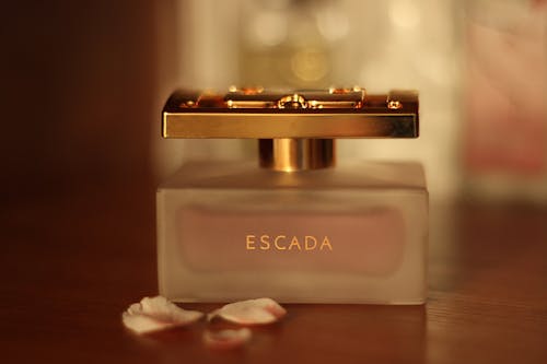 Free Escada Perfume Bottle on Table Stock Photo