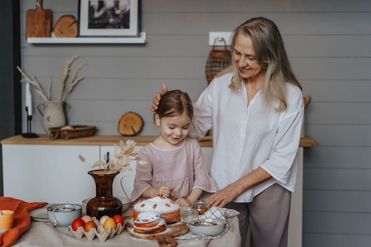 A Grandmother With Her Granddaughter Celebrating Easter