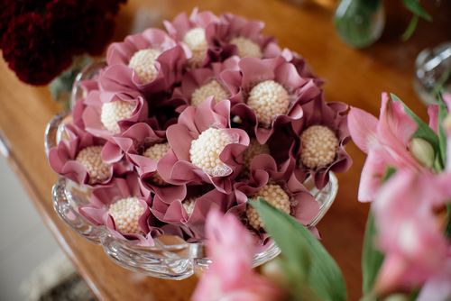 Free A close-up of elegant flower-shaped candies in a glass bowl, perfect for dessert tables. Stock Photo