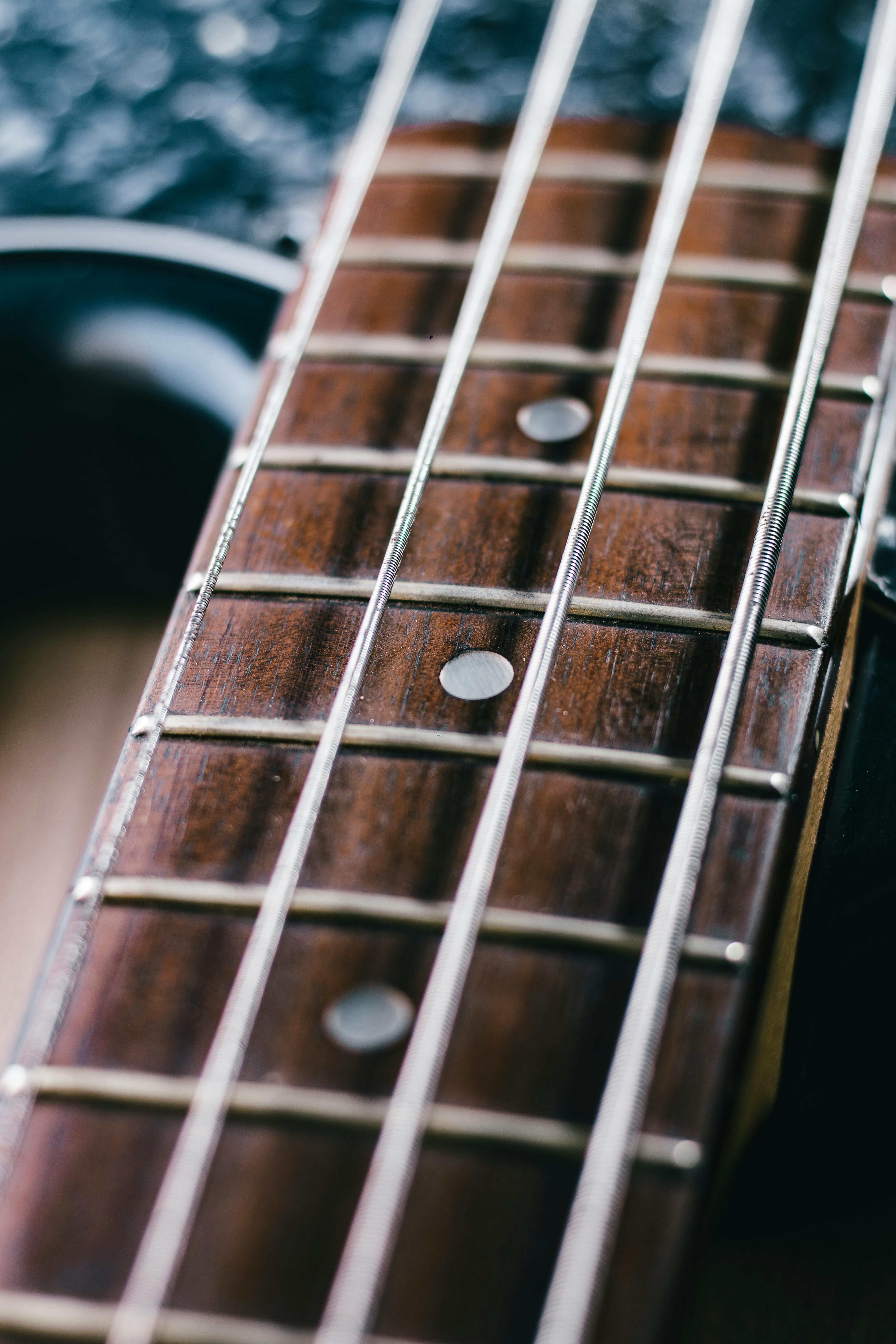 Selective Focus Photo of Black Classical Guitar · Free Stock Photo