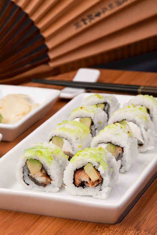 Free A Sushi Maki Roll in a White Plate Stock Photo