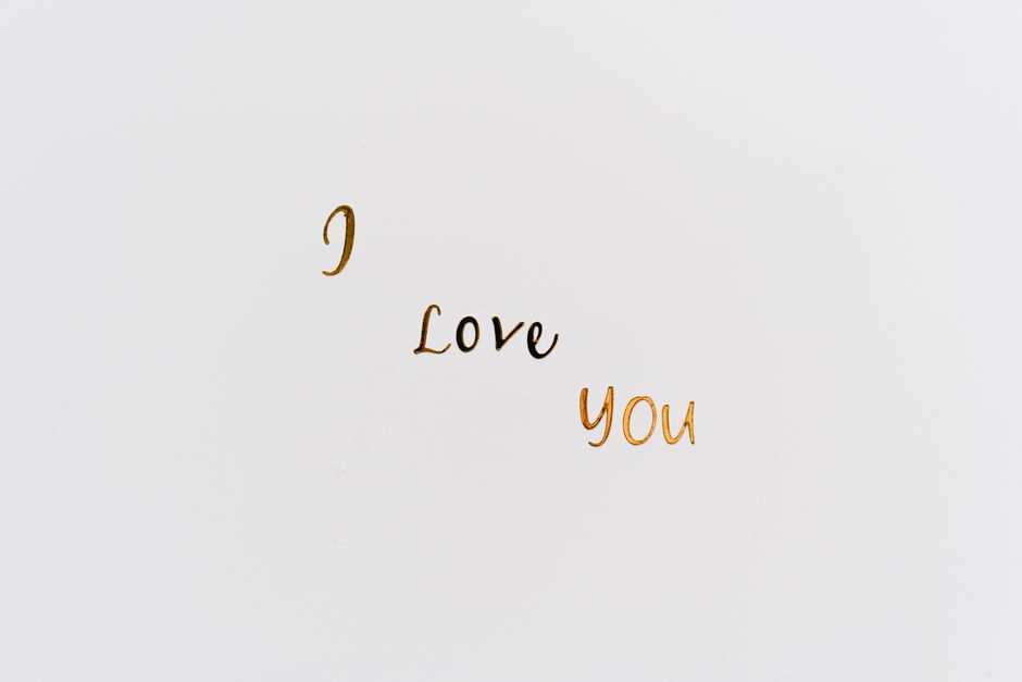 Close-up of 'I Love You' text on white background, perfect for romance themes.